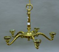 A brass five-branch hanging light. 36 cm high.