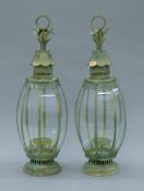 A pair of verdigris lanterns. Each 69 cm high.