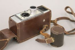 A G B Bell & Howell 624 8mm film camera and lens in original case. 17 cm long.
