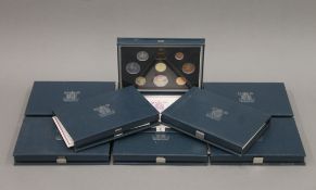 A quantity of cased British proof coin sets. The cases each 17 cm wide.