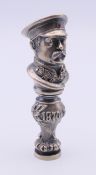 A Russian figural seal. 8 cm high.