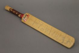 An England West Indies 1991 signed miniature cricket bat. 45.5 cm long.