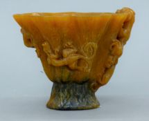 A Chinese libation cup. 9 cm high.