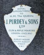 An enamel 'Purdey' sign. 51 cm high.