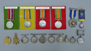 A collection of various WW I and WW II medals and a Victorian South Africa medal with South Africa