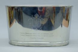 An oval champagne cooler. 43 cm wide.
