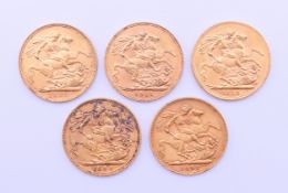 Five gold sovereigns (1894, 1895, 1909, 1911, 1912).