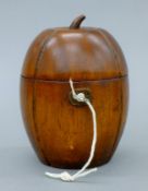 A wooden tea caddy in the form of a melon. 14 cm high.