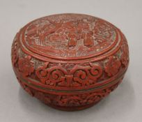 A 19th century Chinese cinnabar lacquered lidded box. 12.5 cm diameter.