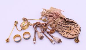 A miser's purse with gilt attachments 10 cm high.