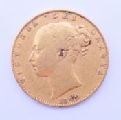 An 1842 gold sovereign.