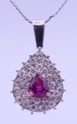 An unmarked diamond pendant on an 18 ct white gold chain.