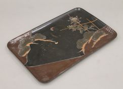 An early 20th century Japanese lacquered tray. 39 cm wide.