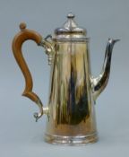 A silver hot water jug. 23 cm high. 707.2 grammes total weight.