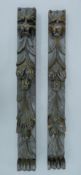 A pair of 19th century oak lion mask-headed carvings. The larger 64.5 cm long.