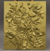 A gold-painted carved wooden floral panel. 44.5 x 51.5 cm.