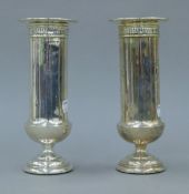 A pair of silver bud vases. 20.5 cm high. 618 grammes total weight.