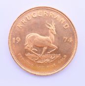 A 1974 gold Krugerrand 1 oz coin.