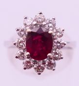 An 18 ct white gold, diamond and ruby ring. Ring size O/P. 6.1 grammes total weight.