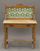 A Victorian pine tiled-back washstand. 92 cm wide.