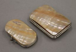A pair of mother-of-pearl purses. The largest 9 cm long.