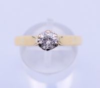An 18 ct gold, 0.5 carat diamond solitaire ring. Ring size R/S. 4.1 grammes total weight.
