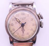 A boxed Longines wristwatch. 3 cm diameter including crown.