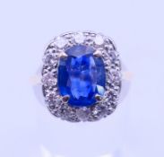 An 18 ct gold, sapphire and diamond ring, the sapphire spreading to approximately 3 carats.