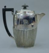 A silver coffee pot. 17.5 cm high. 323.8 grammes.