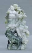 A Chinese stone carving of Buddha, elephant and a bat. 26 cm high.