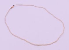 A seed pearl necklace with 9 ct gold clasp. 39 cm long, seed pearls 1 mm diameter.