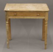 A small Victorian pine single drawer side table. 75 cm wide.