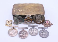 A quantity of militaria, to include a 1914 Christmas tin, 1914-1918 replica medals,