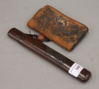 A Japanese purse and a cased pipe. The case 20.5 cm long.