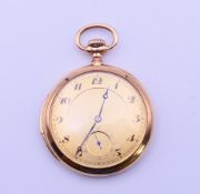A 14 K gold open faced striking pocket watch. 5.25 cm diameter. 90.4 grammes total weight.