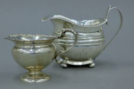 Two silver cream jugs. The larger 14 cm long. 217.9 grammes.