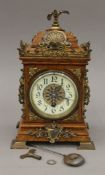 A Victorian brass mounted oak mantle clock. 28 cm high.