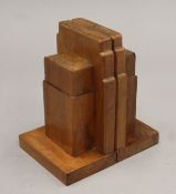 A pair of Gordon Russell Art Deco yew wood bookends. 17 cm high.