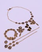 A collection of Komai jewellery to include two necklaces, a bracelet and a pair of earrings.