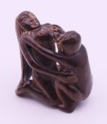 An erotic horn netsuke. 4.5 cm high.