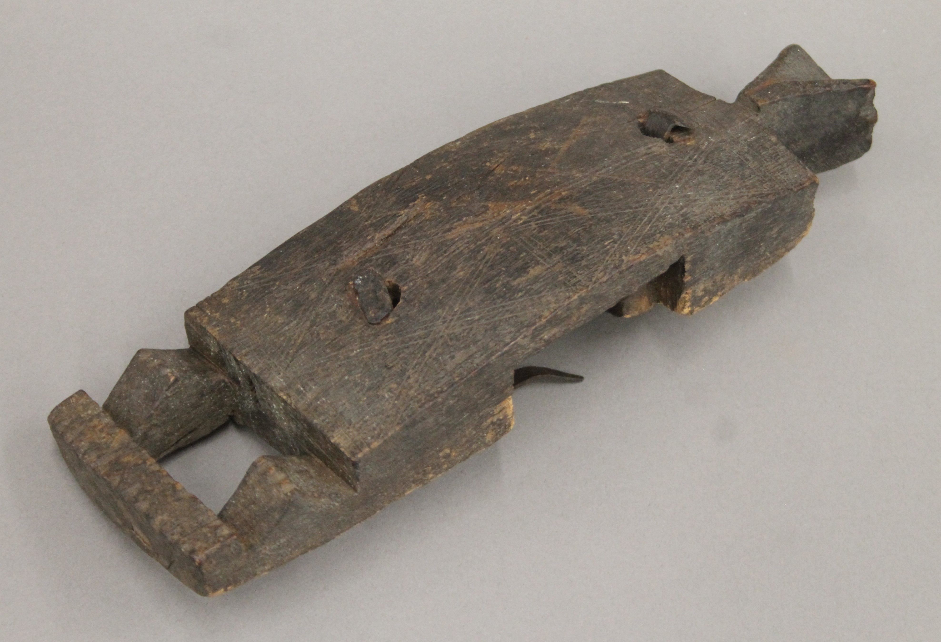 An African tribal carved wooden door handle of figural form. 29 cm high. - Image 2 of 4