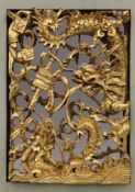 A framed Chinese pierced gilt painted carved wooden panel. 37.5 x 31 cm.
