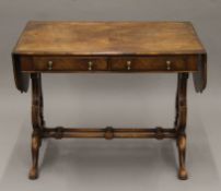 An early 20th century walnut sofa table, with label to drawer interior for TOZER, 25 BROOK STREET,