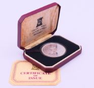 A boxed 1977 silver proof crown to commemorate the Queen's Silver Jubilee.