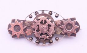 A Victorian gold inset silver brooch. 4.5 x 2 cm.