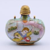 A Canton enamel snuff bottle and stopper. 5.3 cm high.