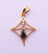 A 9 k gold sapphire pendant. 3 cm high overall. 2.7 grammes total weight.