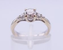 An 18 ct white gold five-stone diamond ring, the centre stone approximately 0.5 carat.