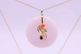 A 14 ct gold and multi-coloured jade pendant on a 9 ct gold chain.
