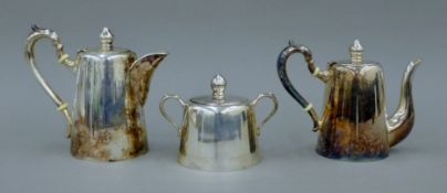 A 925 silver three-piece tea set. The teapot 16 cm high. 791.3 grammes total weight.